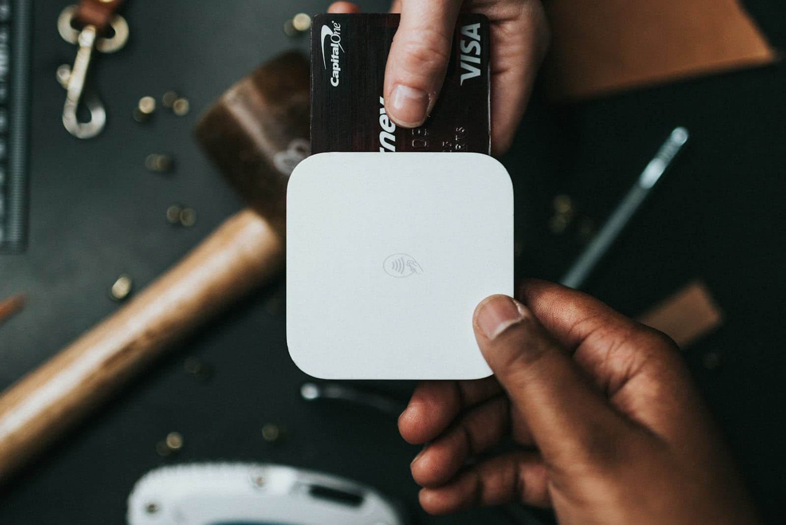 Payment card reader and credit cards representing ecommerce checkout systems.